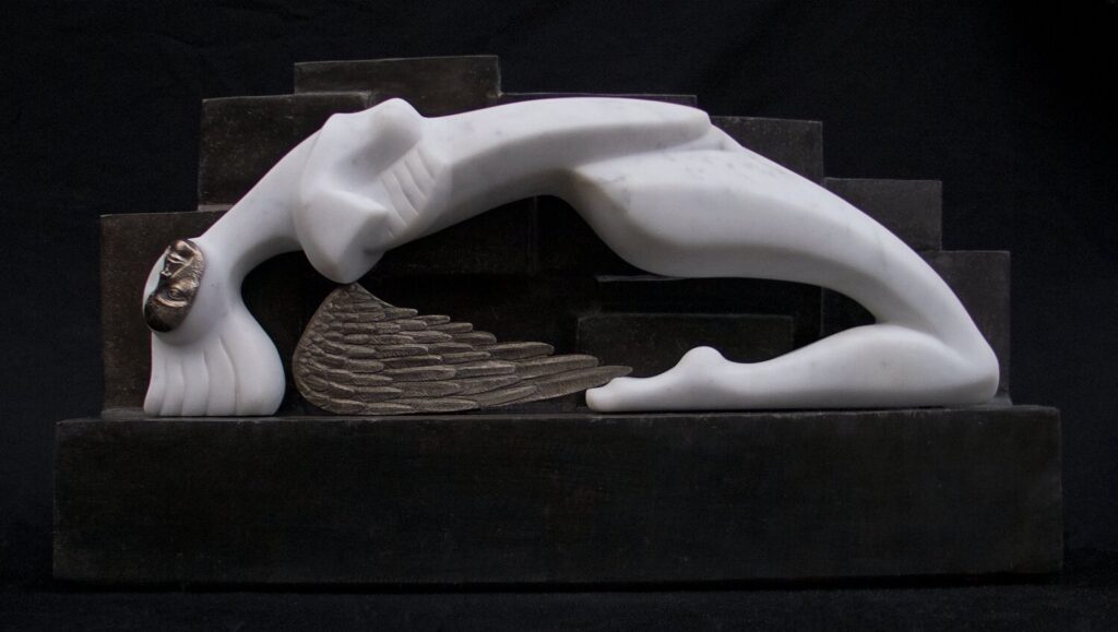 A marble sculpture of a figure bending backwards with wings.