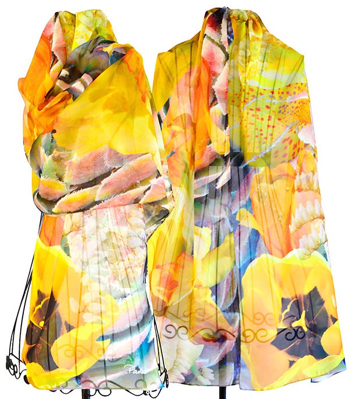 A chiffon scarf printed with yellow flowers and other colorful designs.