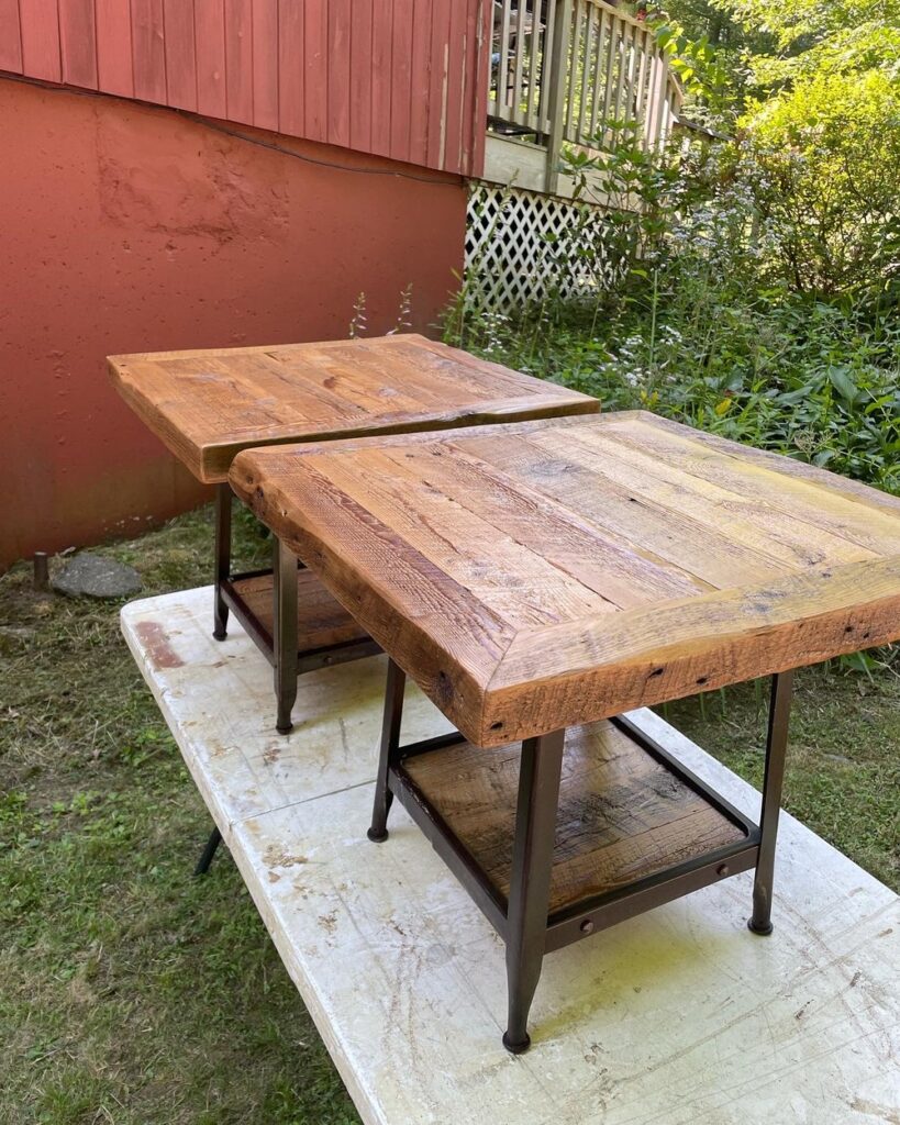 Two wooden tables with metal bases.
