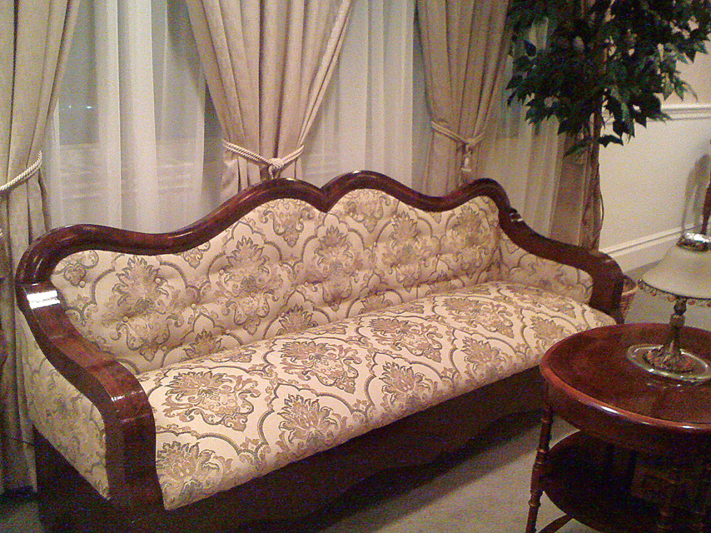 An antique upholstered couch.